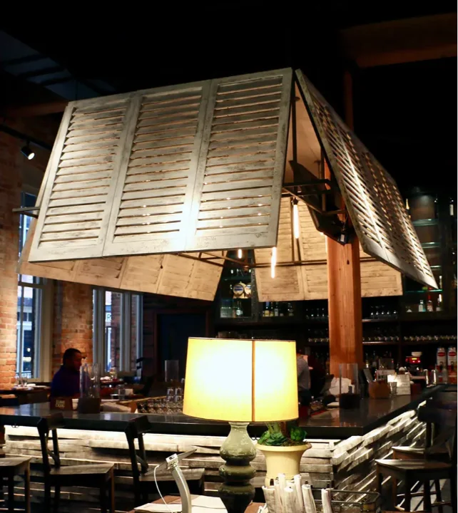 Brown-Louvered-interior-shutters-on-lighting-fixture-Central-Restaurant-Montgomery-2