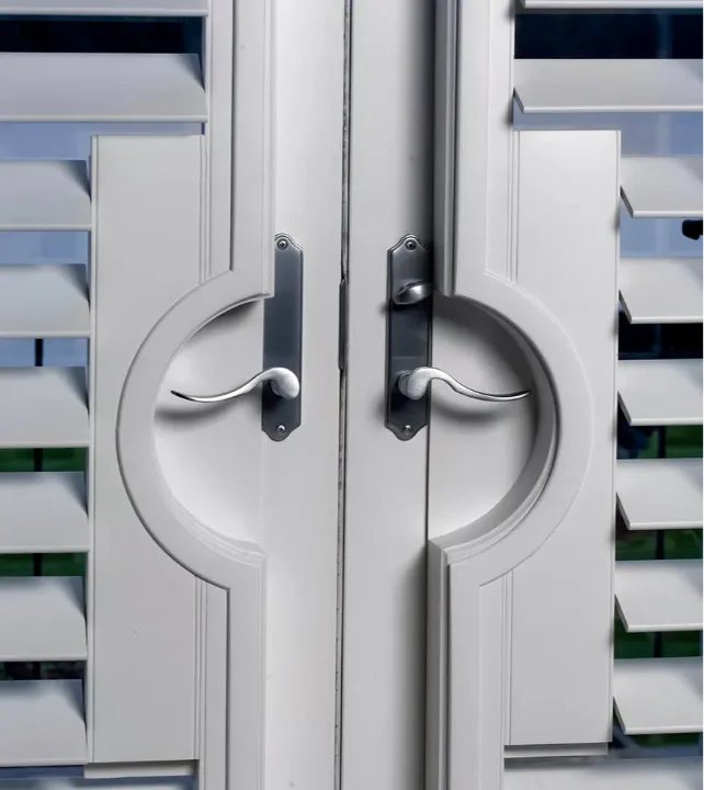 White Moveable Louvered interior-doors-and-windows-in-blue-boat-house knob-details