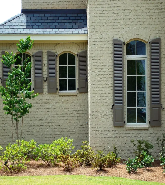combination.exterior.gray.brown.beige.arch.window