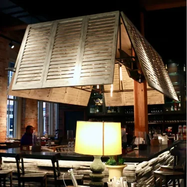 Brown-Louvered-interior-shutters-on-lighting-fixture-Central-Restaurant-Montgomery-2