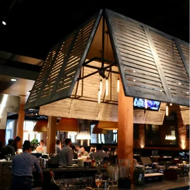 Brown-Louvered-interior-shutters-on-lighting-fixture-Central-Restaurant-Montgomery-3