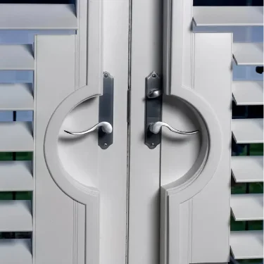 White Moveable Louvered interior-doors-and-windows-in-blue-boat-house knob-details