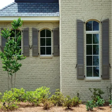 combination.exterior.gray.brown.beige.arch.window