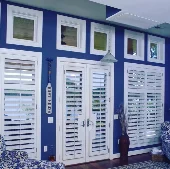 White-Moveable-Louvered-interior-doors-and-windows-in-blue-boat-house